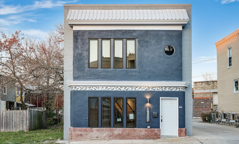 2504 Barclay Street after renovation. Single family home painted blue and gray.