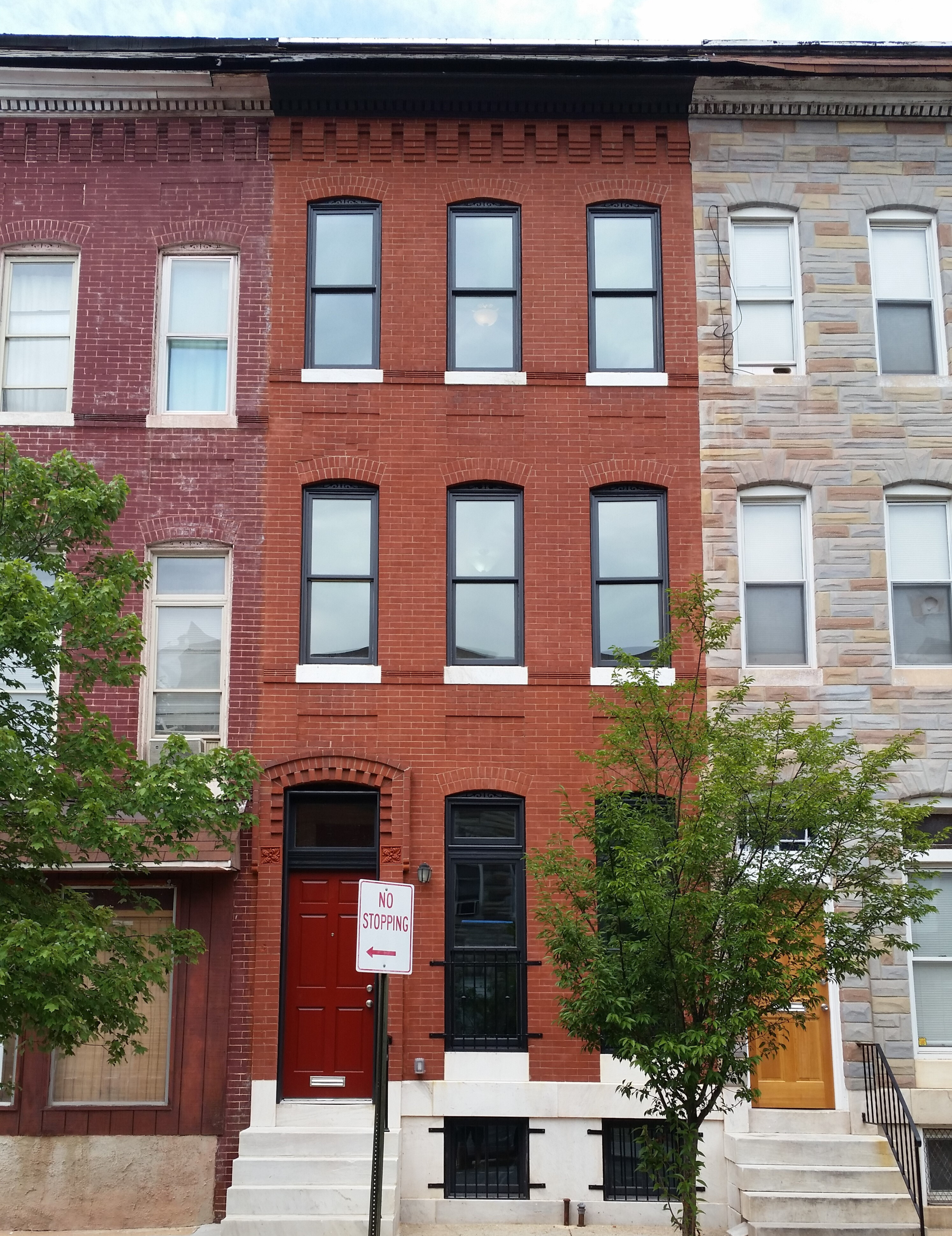 426 Mosher Street after renovation. Red brick rowhome in Baltimore City.
