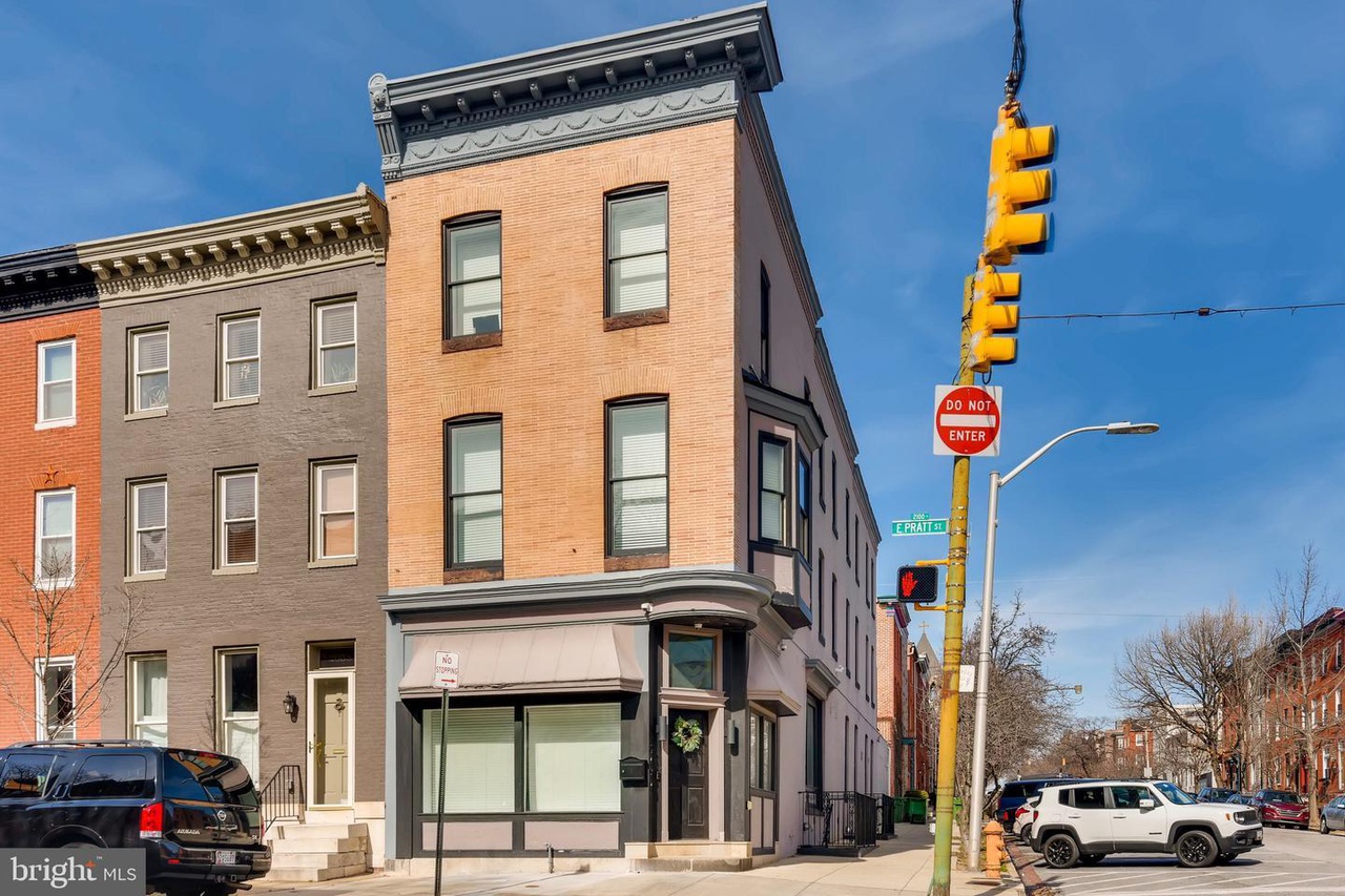 2040 E. Pratt Street after renovation. Three story brick rowhome in Baltimore City.