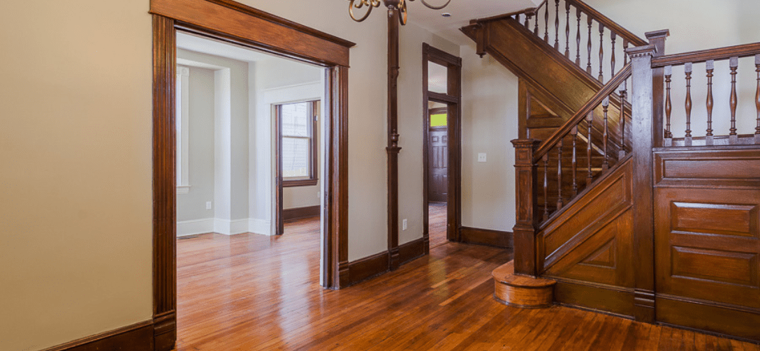 4107 Walrad Street interior with wooden staircase.