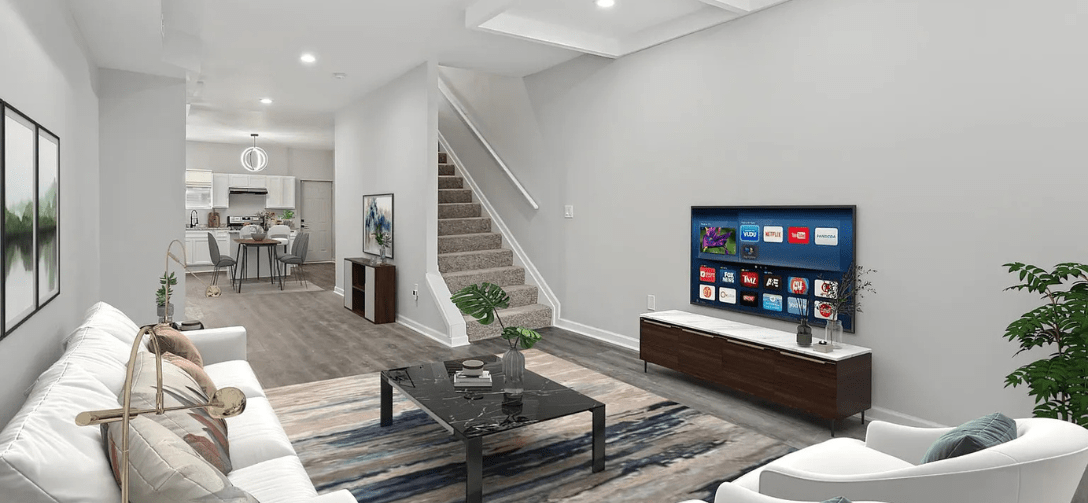 547 N. Pulaski Street interior living room with white couches and television.